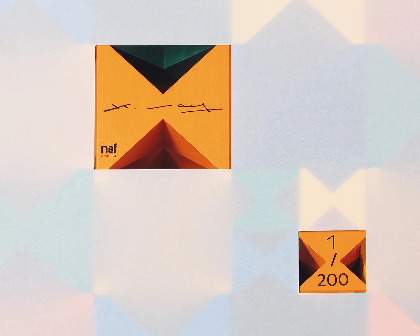 Close up of the siginatures and numbers on the Naef spiel signature edition limited spiel block set. Tribute to Kurt Naef on the 100th anniversary of the founder's birth featuring a 60's inspired colour pallete. 