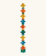 Naef spiel special 100 year edition spiel block set shown stacked into a tall tower. Tribute to Kurt Naef on the 100th anniversary of the founder's birth featuring a 60's inspired colour pallete. 