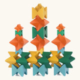 Naef spiel special 100 year edition spiel block set shown stacked into a tower structure. Tribute to Kurt Naef on the 100th anniversary of the founder's birth featuring a 60's inspired colour pallete. 
