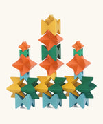 Naef spiel special 100 year edition spiel block set shown stacked into a tower structure. Tribute to Kurt Naef on the 100th anniversary of the founder's birth featuring a 60's inspired colour pallete. 