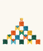 Naef spiel special 100 year edition spiel block set shown stacked into a pyramid like tower structure. Tribute to Kurt Naef on the 100th anniversary of the founder's birth featuring a 60's inspired colour pallete. 