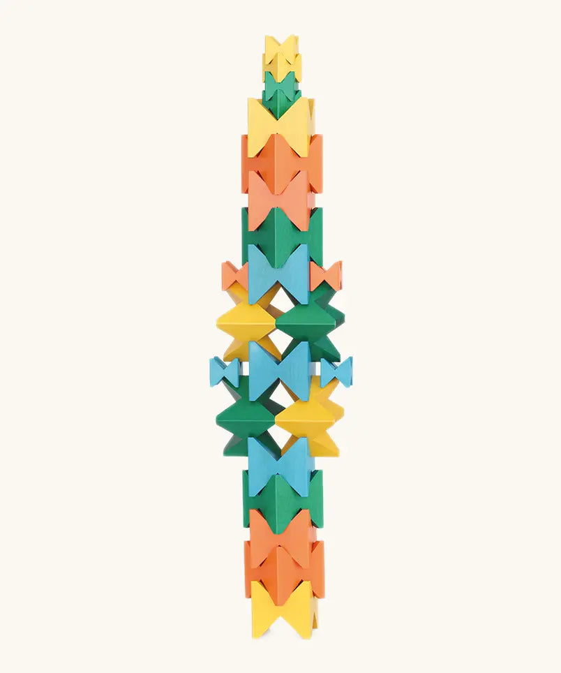 Naef spiel special 100 year edition spiel block set shown stacked into a tower. Tribute to Kurt Naef on the 100th anniversary of the founder's birth featuring a 60's inspired colour pallete. 