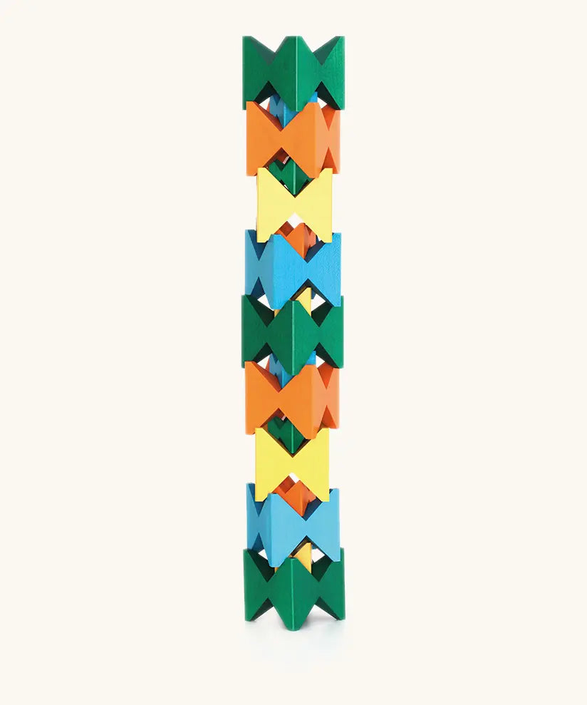 Naef spiel special 100 year edition spiel block set shown stacked into a tower. Tribute to Kurt Naef on the 100th anniversary of the founder's birth featuring a 60's inspired colour pallete. 