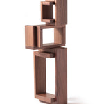 The Naef Walnut Corus stacked to create an interesting wooden sculpture.