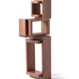 The Naef Walnut Corus stacked to create an interesting wooden sculpture.