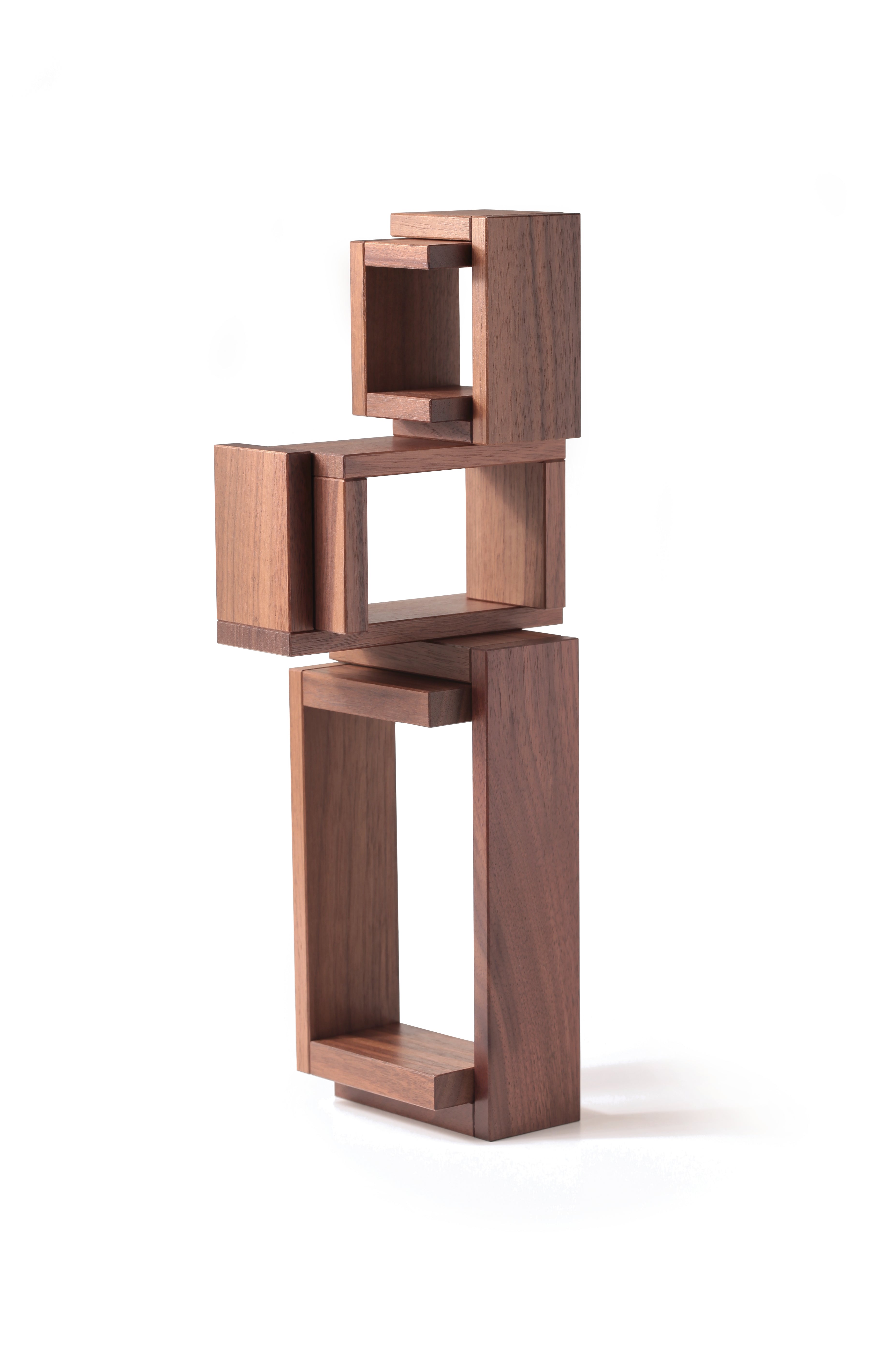 The Naef Walnut Corus stacked to create an interesting wooden sculpture.
