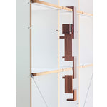 The Naef Walnut Corus, hanging from a shelf to create an interesting sculpture.