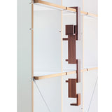 The Naef Walnut Corus, hanging from a shelf to create an interesting sculpture.