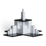 Naef tectus premium wooden stacking toy blocks set piled up in a geometric shape on a white background