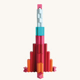 Rocket-shaped structure built from Naef Tigno coloured wooden pieces. Handcrafted precision German made stacking game and architectural desk toy.
