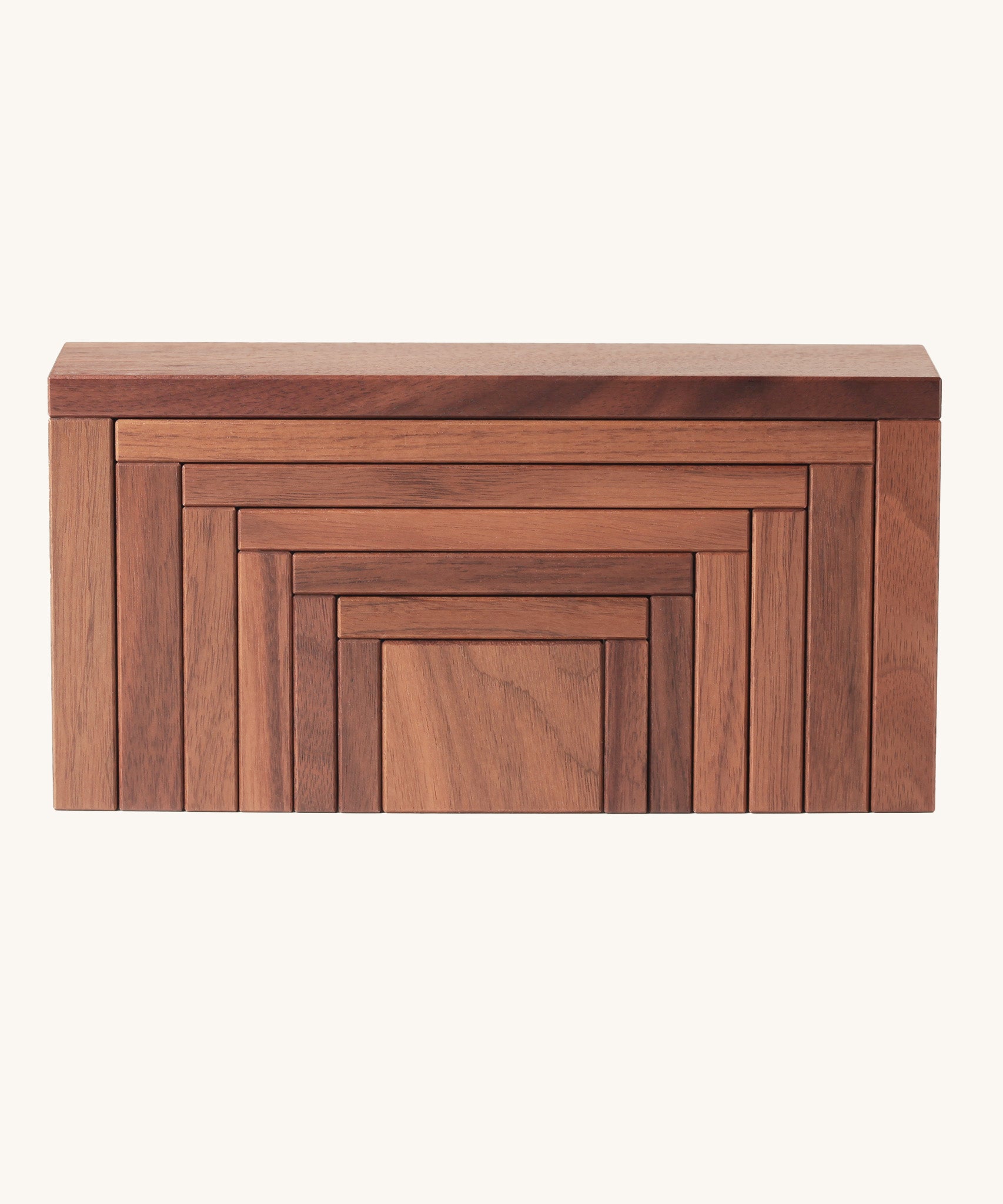 The Naef Corus wooden stacking toy, with all seven pieces neatly stacked on top of each other to form a cuboid.