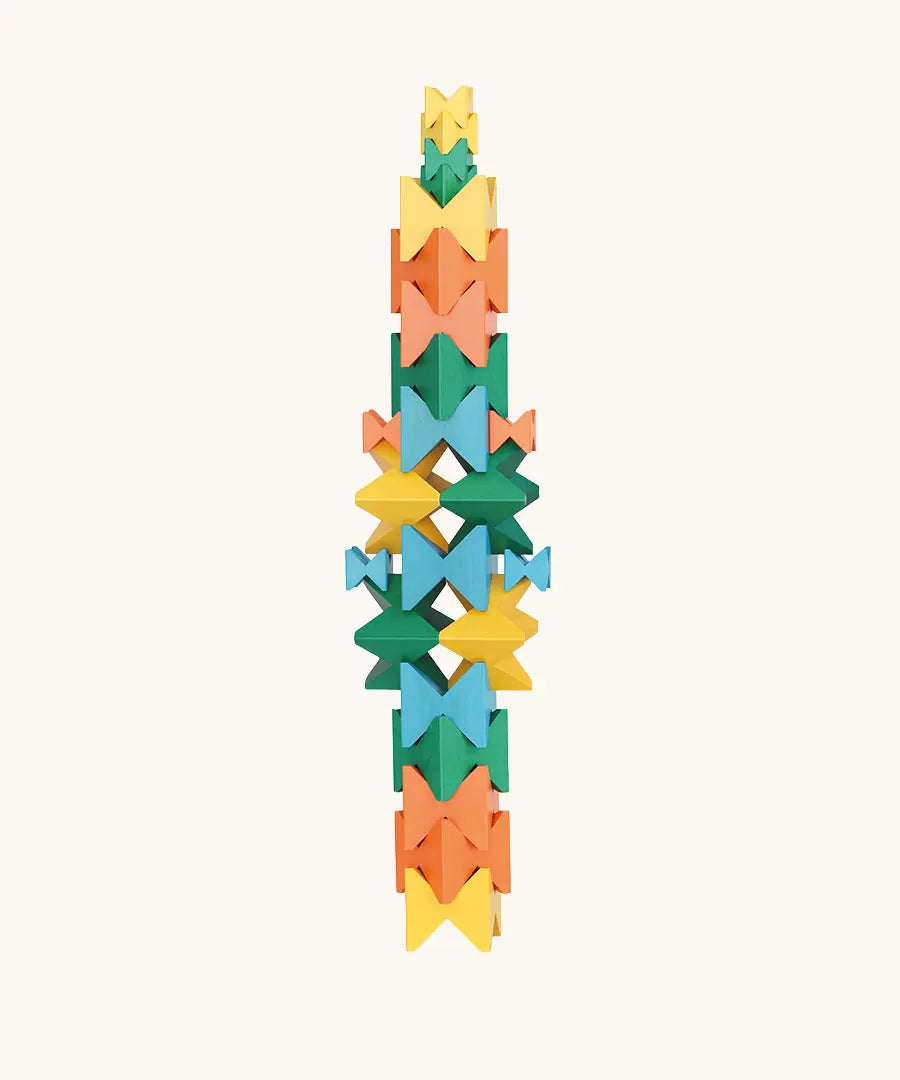 Naef Spiel signature stamped edition cubes stacked up to form a tall tower.