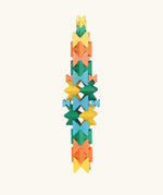 Naef Spiel signature stamped edition cubes stacked up to form a tall tower.