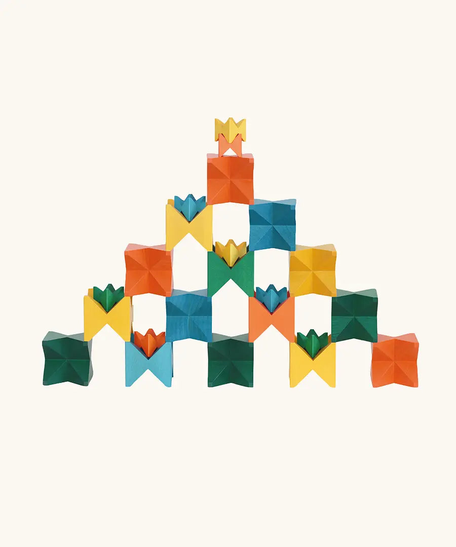 Naef Spiel signature stamped edition cubes stacked up to form a pyramid like shape.