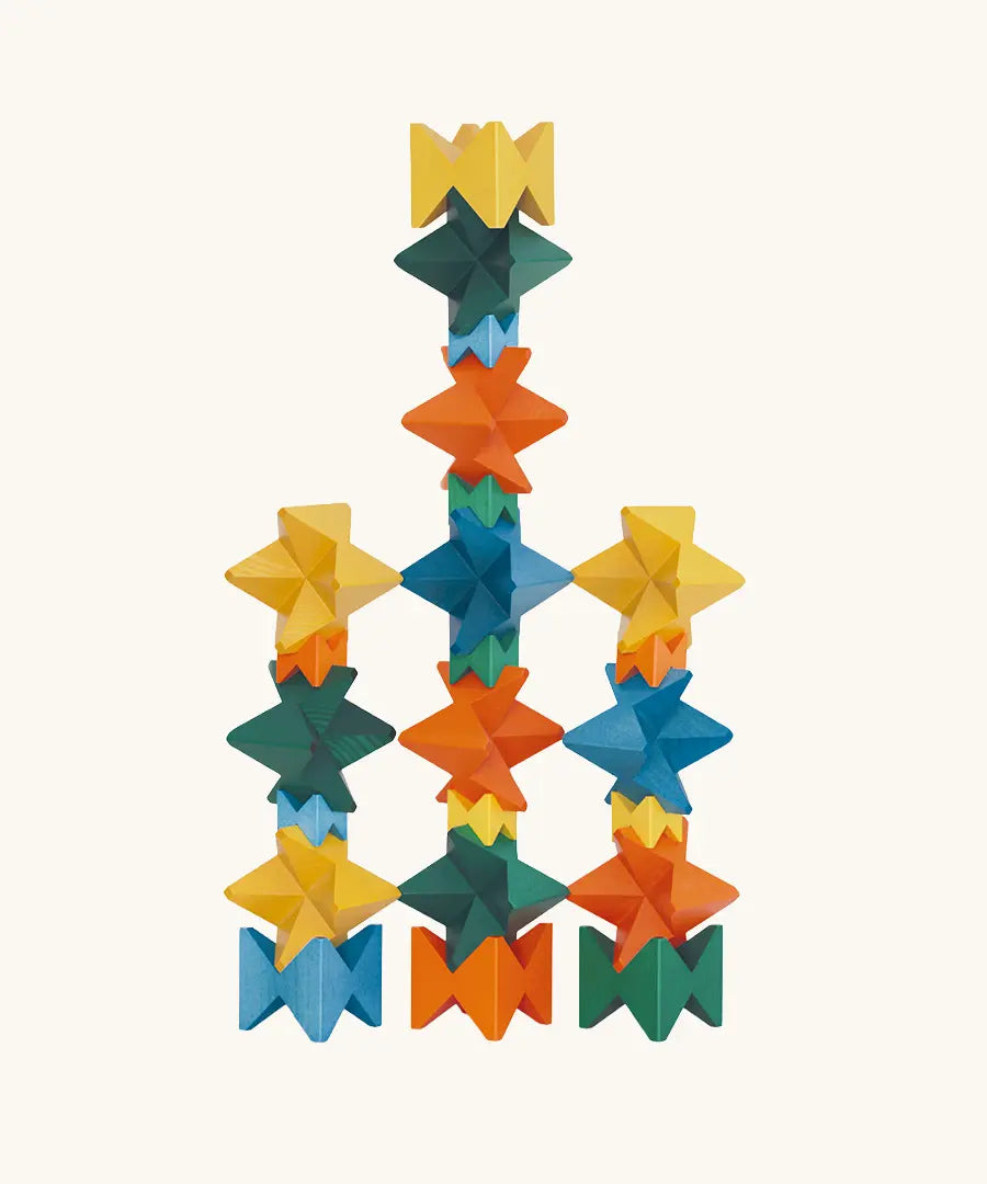Naef Spiel signature stamped edition cubes stacked up to form three towers.
