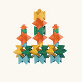 Naef Spiel signature stamped edition cubes stacked up to form three towers on a long base.