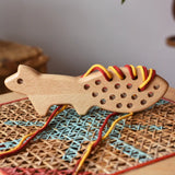 Bajo natural lacing fox placed on a rattan stool in the Babipur playroom.