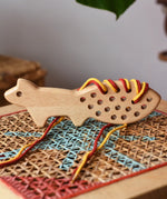 Bajo natural lacing fox placed on a rattan stool in the Babipur playroom.