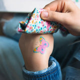 Butterfly tattoo from the Namaki butterfly face painting kit applied to a child's hand.