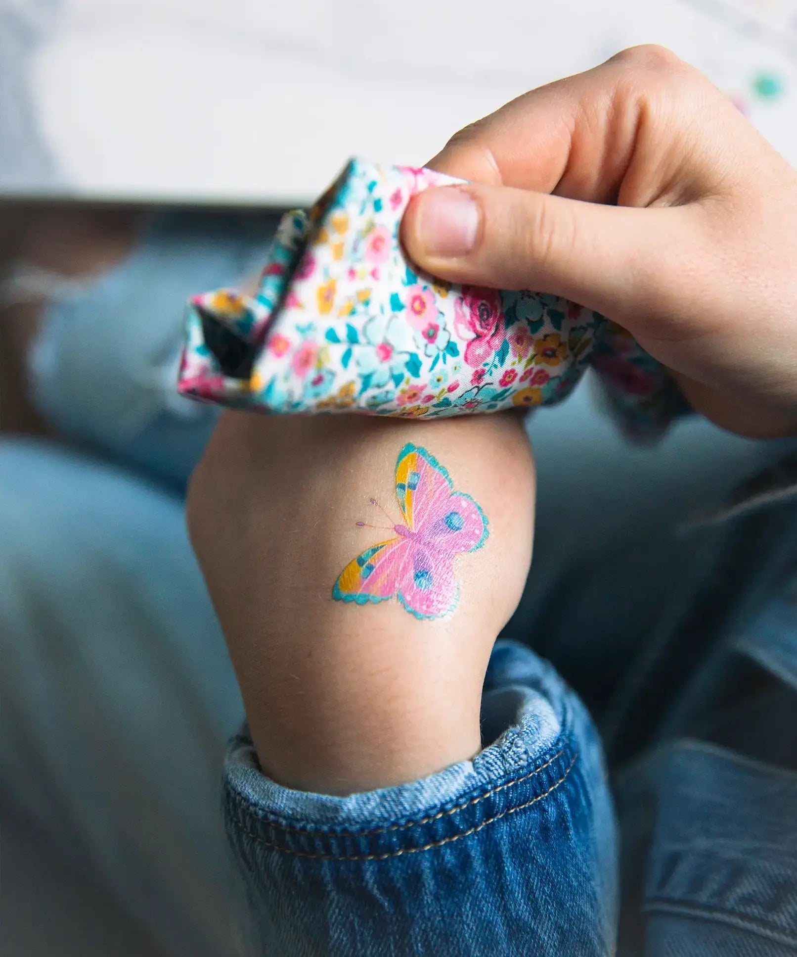 Butterfly tattoo from the Namaki butterfly face painting kit applied to a child's hand.