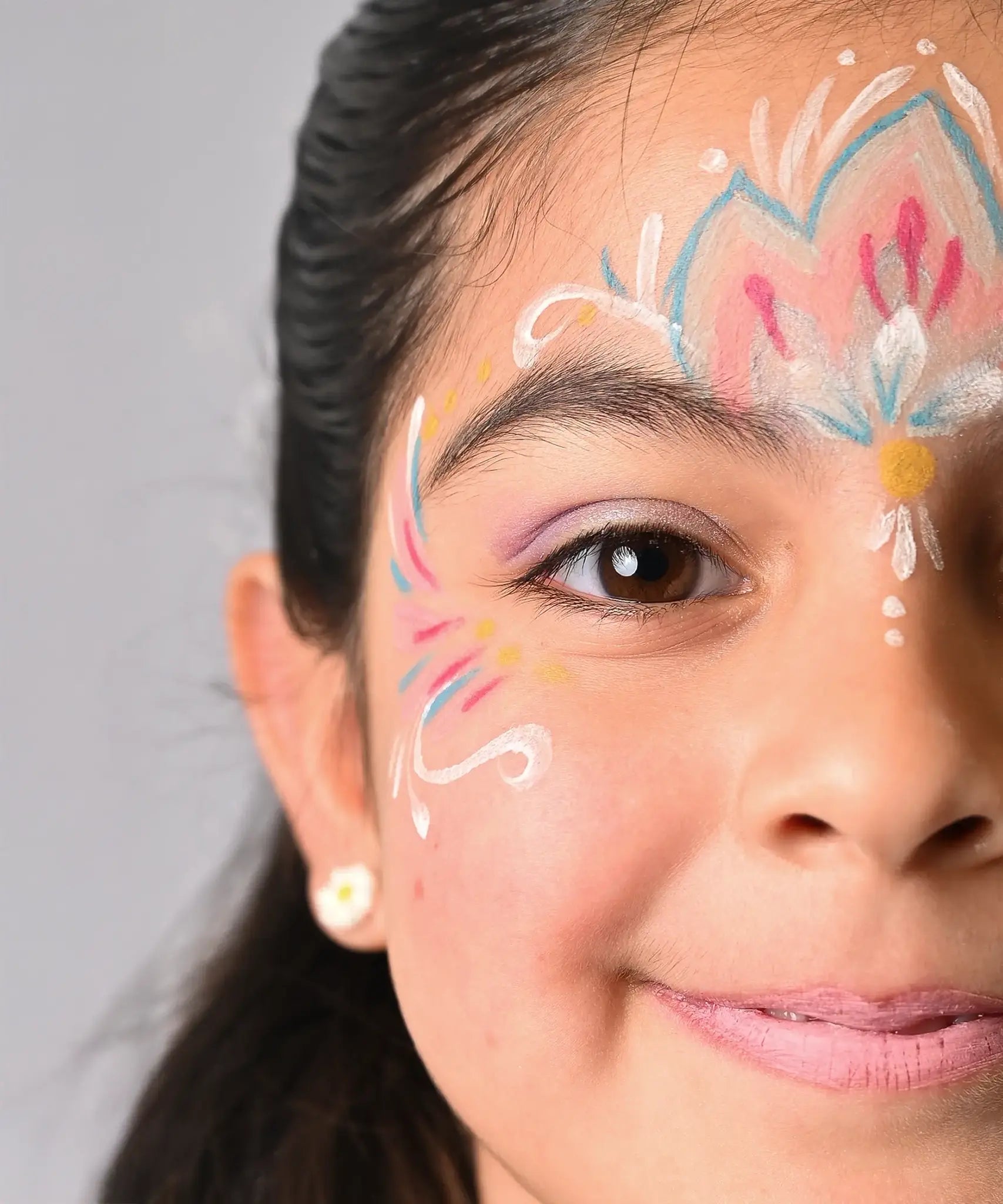 Namaki mermaid face painting kit  used to create a mermaid design on a child's face.
