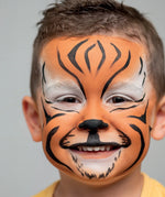Namaki tiger face painting kit used for a tiger design face paint on a child.