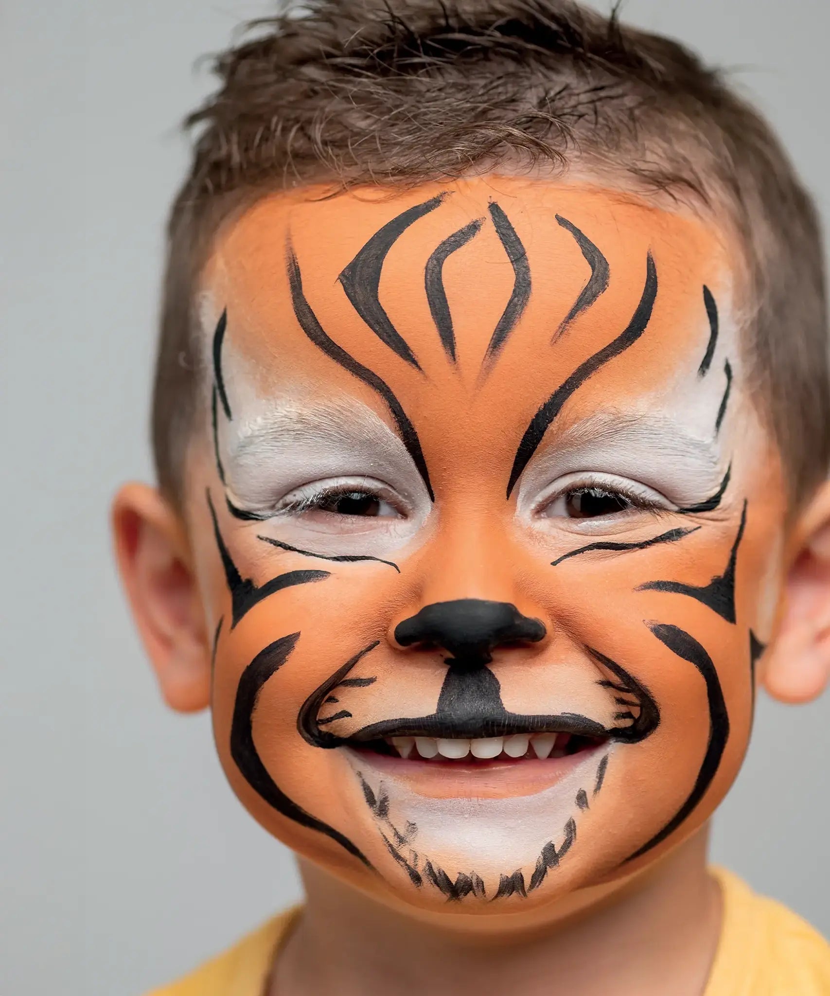 Namaki tiger face painting kit used for a tiger design face paint on a child.