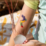 Toucan tatoo from the Namaki tiger face painting kit applied to a child's arm.