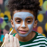 Child having face painted with Namaki natural water-based kids' blue face paint .