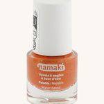 Orange Namaki nail polish from the fairy moonlight set on a cream background.