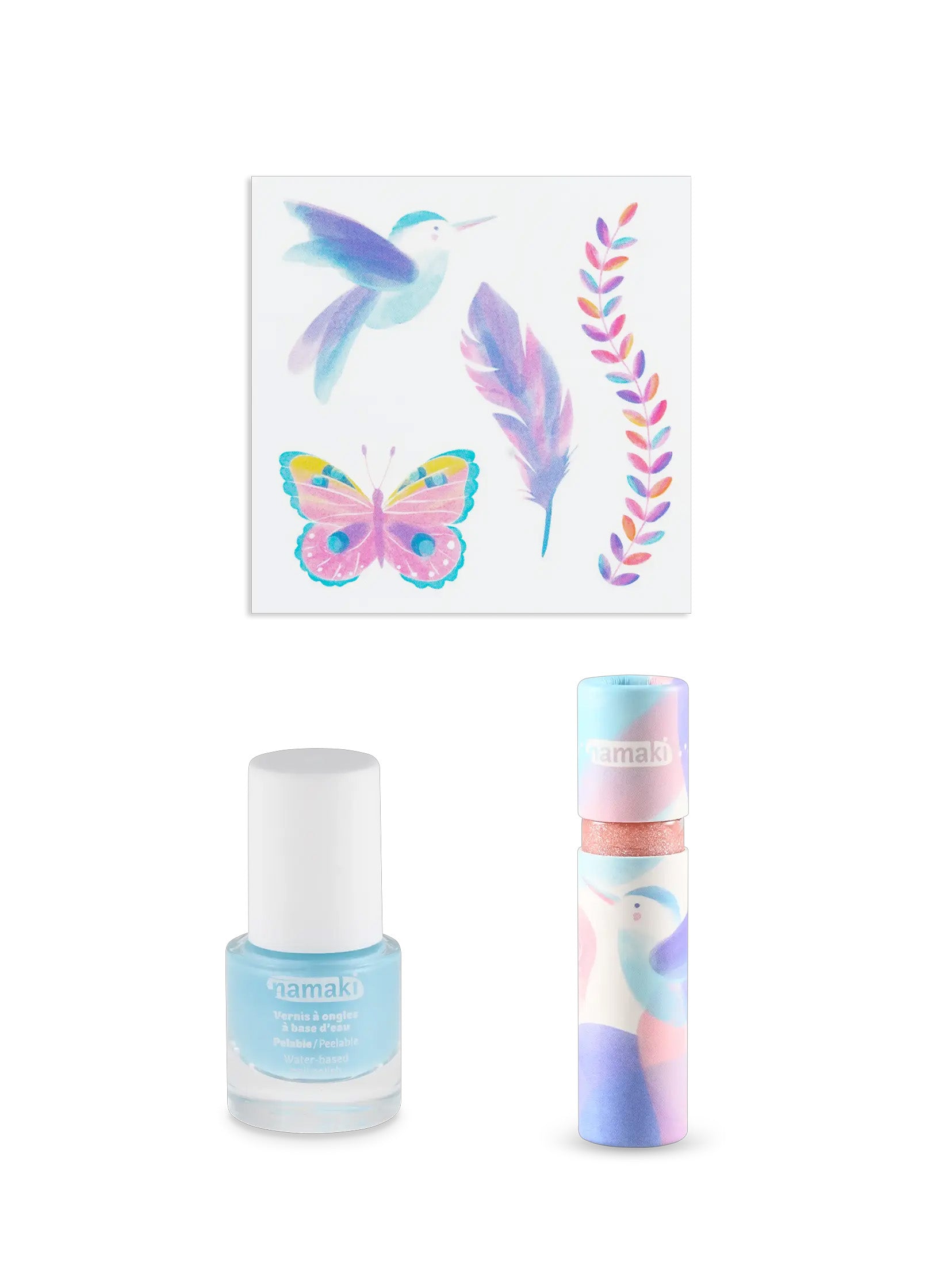 The contents of the Namaki Hummingbird makeup trio giftset at Babipur; a non-toxic blue nail polish, a sheet of temporary tattoos, a natural and organic lip gloss.