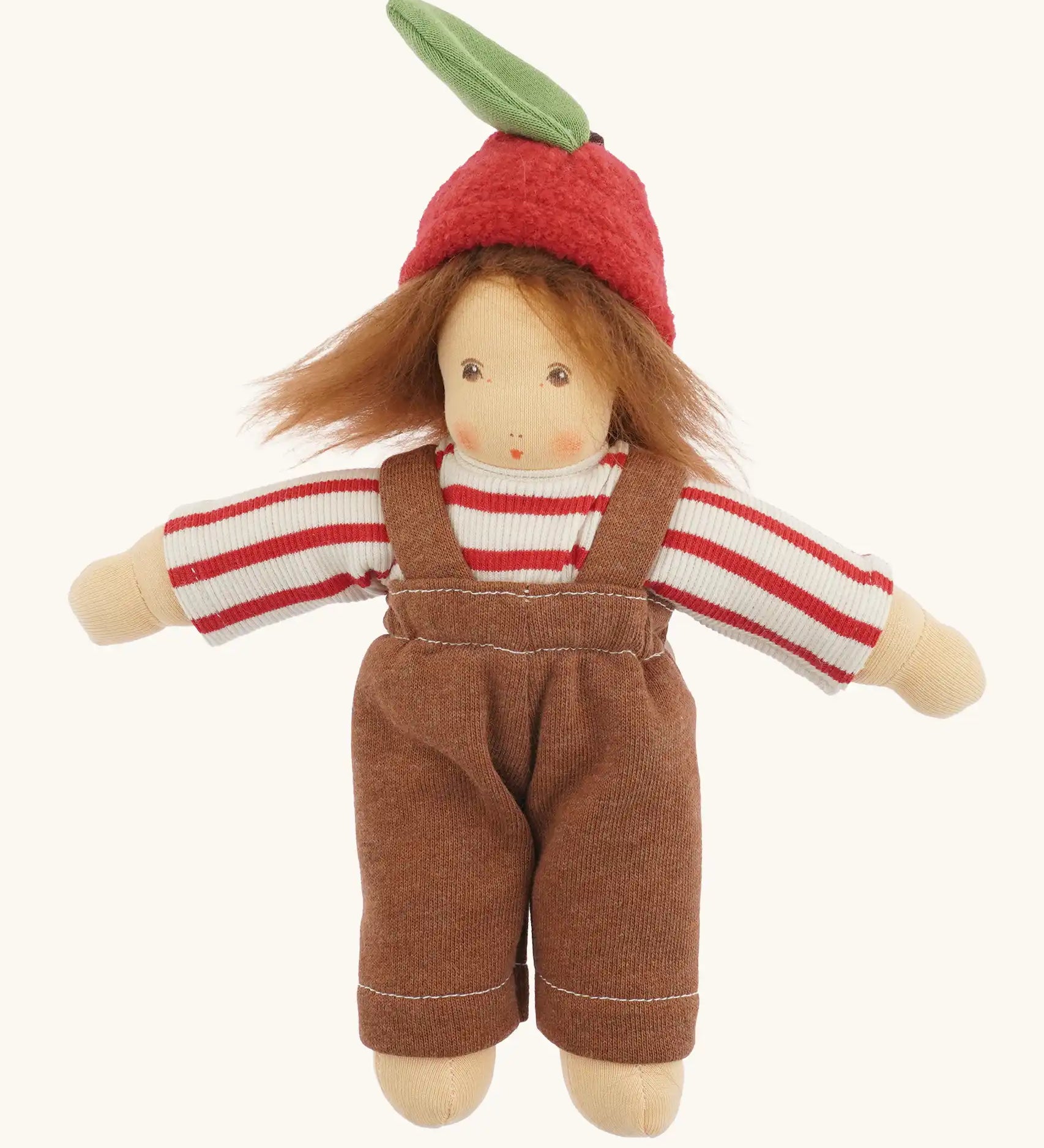 Nanchen apple child Waldorf doll Anna with red and white striped top, brown dungarees and apple shaped felt hat.