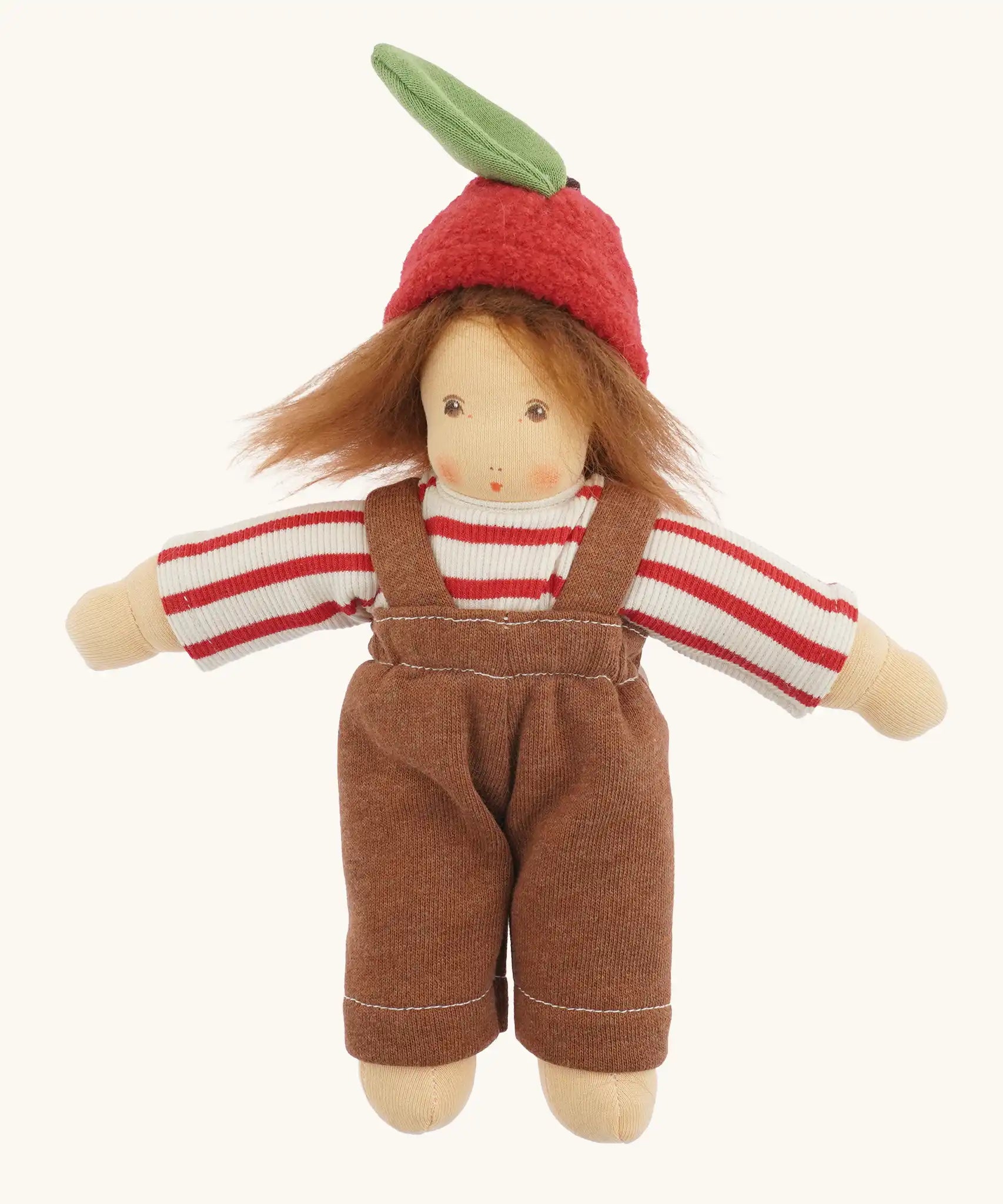 Nanchen apple child Waldorf doll Anna with red and white striped top, brown dungarees and apple shaped felt hat.