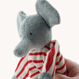 A close up of the Nanchen elephant baby comforter soft toy's trunk. The grey elephant has a red and white striped body.