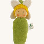 Nanchen Flower Rattle Doll - Daisy, is a soft, organic and handmade sensory doll toy with a green body, a little greet hat with white daisy leaves and a yellow strip of fabric to mimic hair. This doll also has an adorable face with green eyes