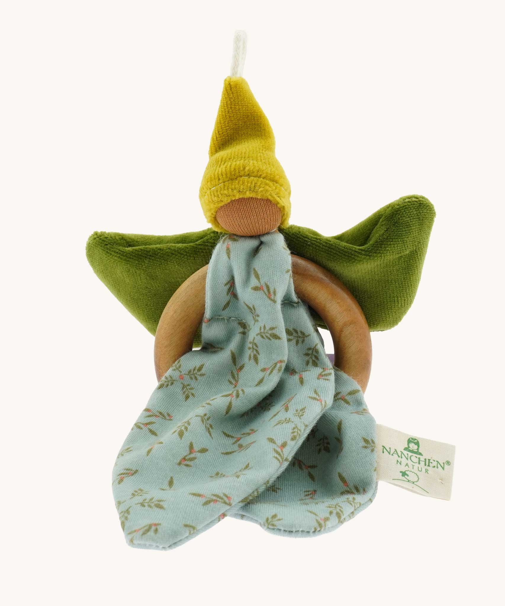 Nanchen green Flower Fairy Ring Grasper. A soft toy attached to a wooden ring that can be used as a grasping toy or hung up.