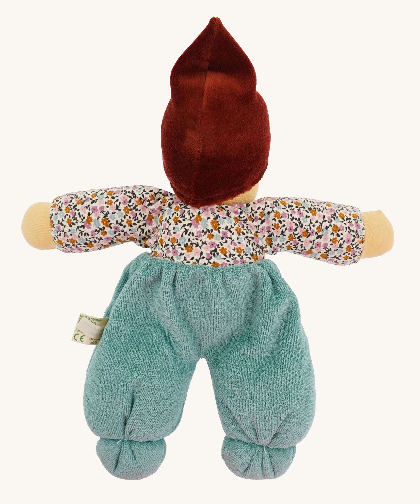 The back of a Nanchen Forest Child Organic and Handcrafted Waldorf Doll in sage green.