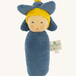 Nanchen Flower Rattle Doll - Forget-Me-Not, is a soft, organic and handmade sensory doll toy with a blue body, a little blue hat with blue forget-me-not leaves and a yellow strip of fabric to mimic hair. This doll also has an adorable face with blue eyes
