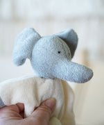 A close up of the Nanchen Elephant Teddy Rattle face, showing the texture of the material.