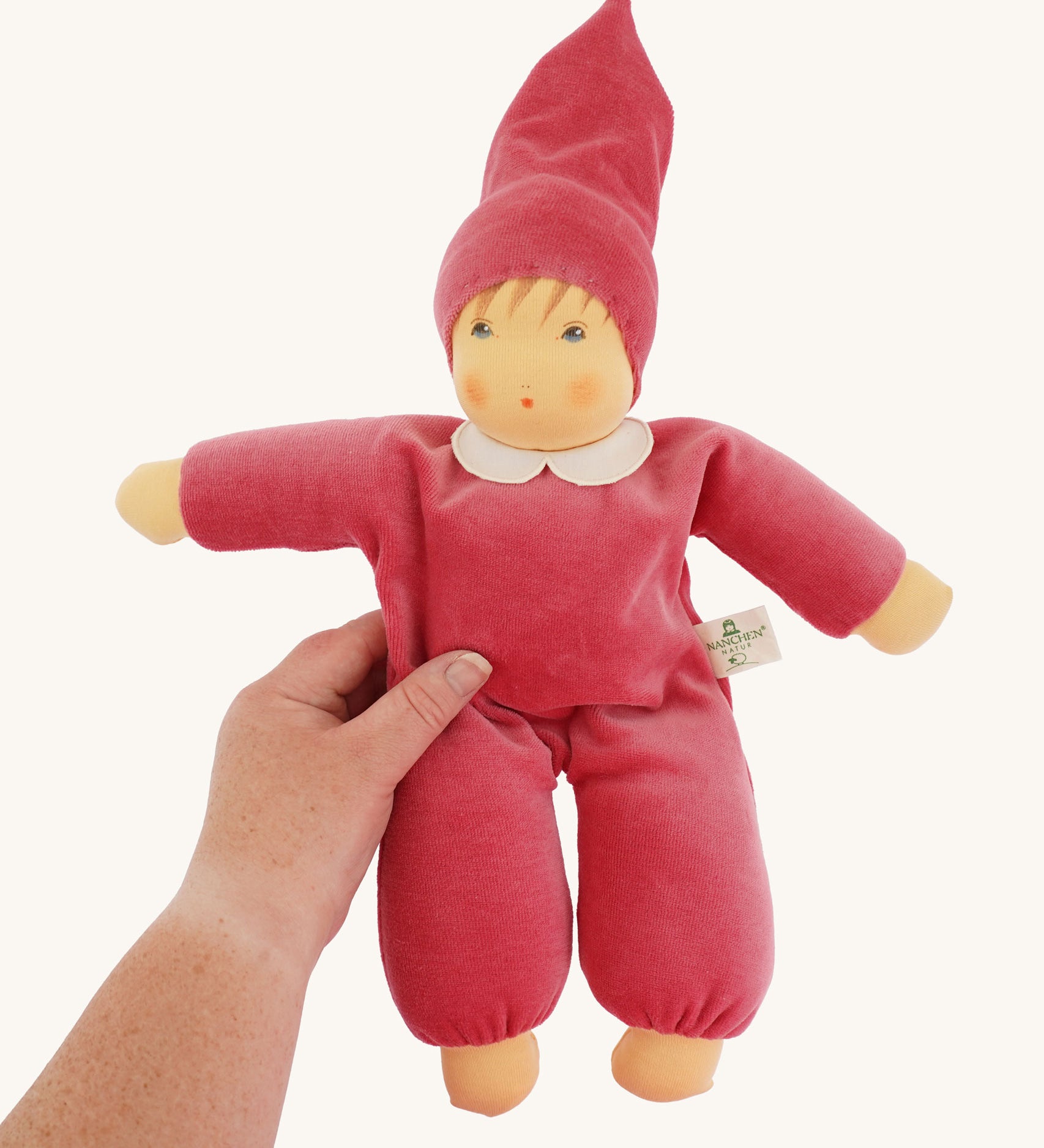 The Nanchen Nani Waldorf Doll with a Pink coloured outfit. 