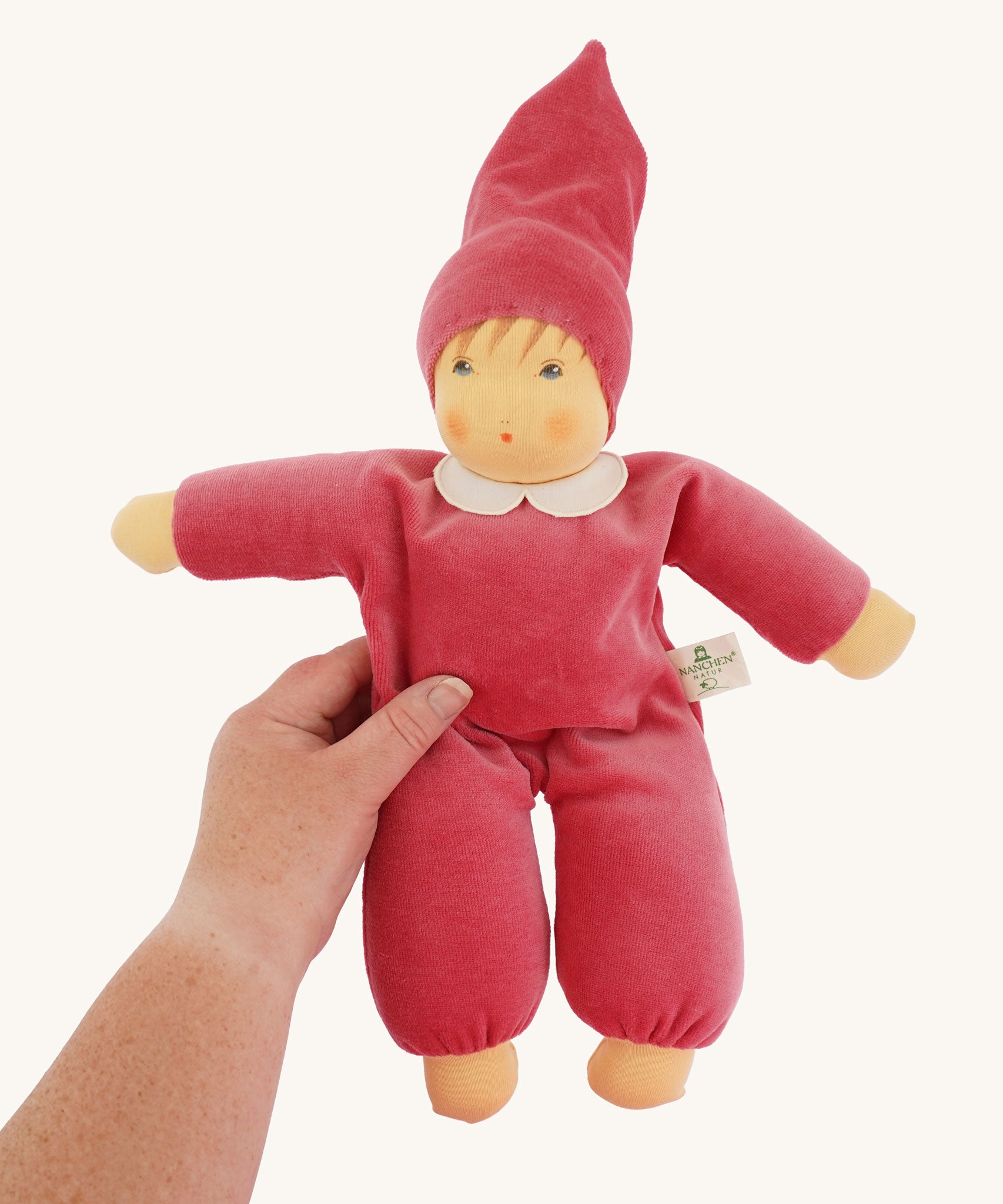 The Nanchen Nani Waldorf Doll with a Pink coloured outfit. 