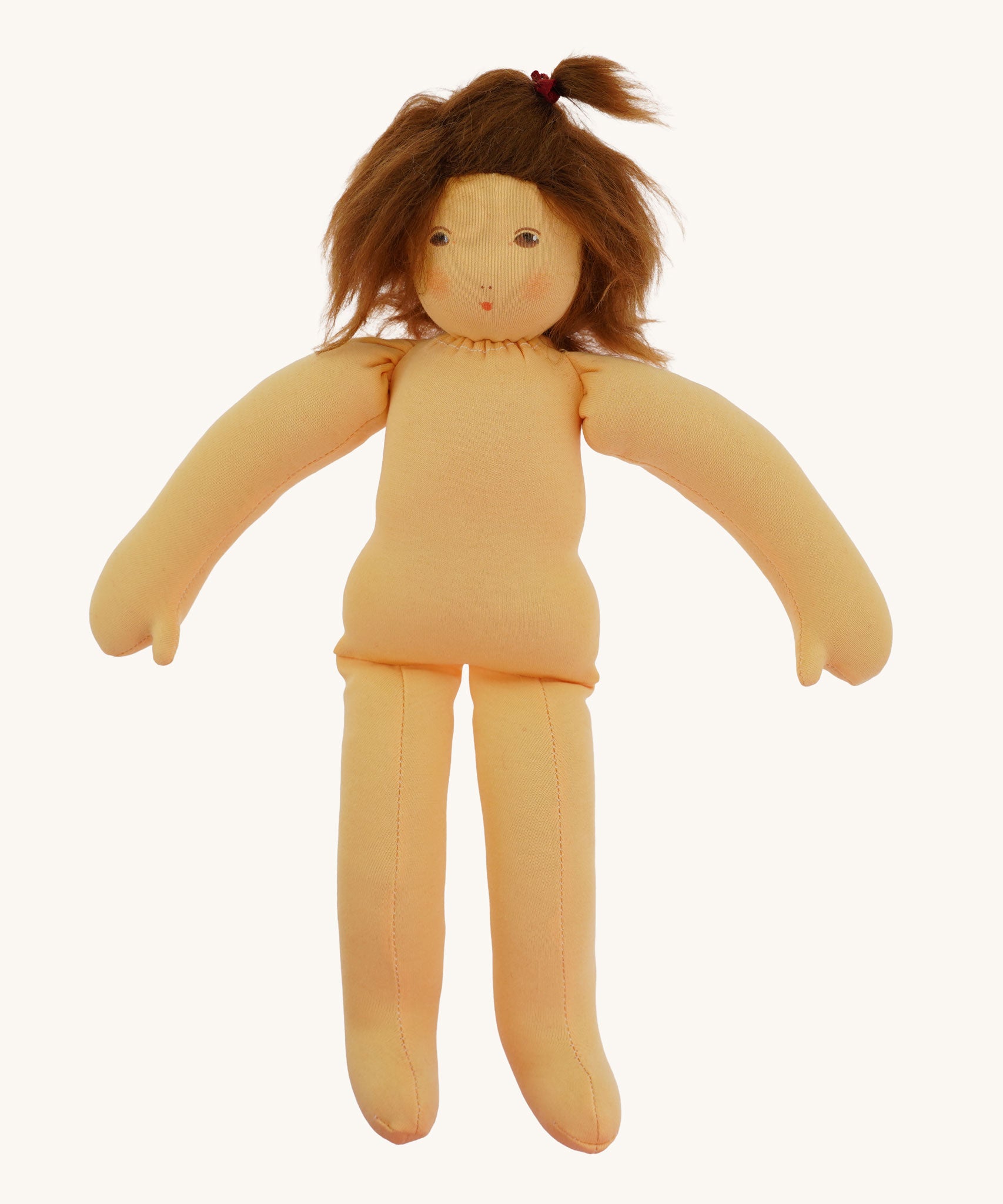 The  Nanchen handcrafted Little Red Riding Hood Waldorf doll shown with no clothes on. 