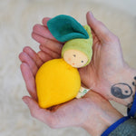 Nanchen Lemon Rattle Doll - organic doll in a persons hands.