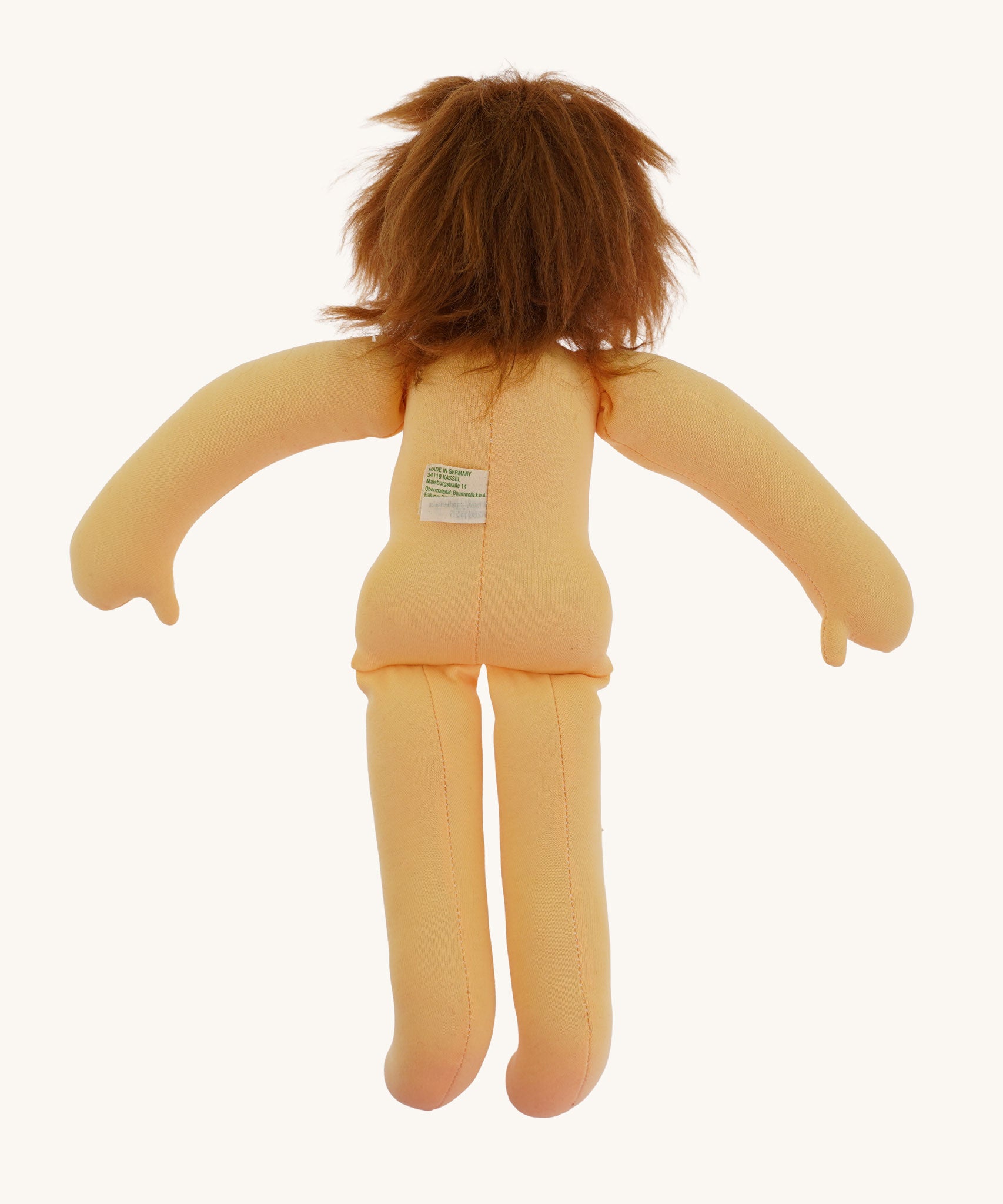 The back of the  Nanchen handcrafted Little Red Riding Hood Waldorf doll with no clothes on. 