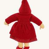The back of the  Nanchen handcrafted Little Red Riding Hood Waldorf doll. The doll has the hood of the coat up.