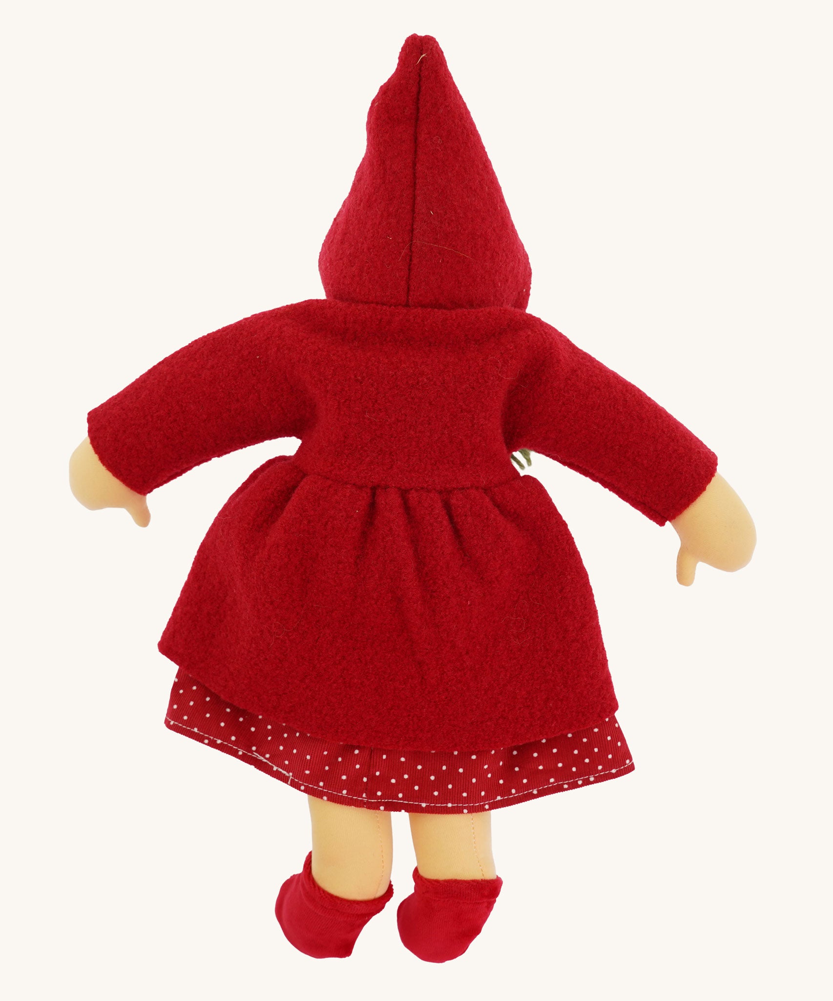 The back of the  Nanchen handcrafted Little Red Riding Hood Waldorf doll. The doll has the hood of the coat up.