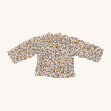 Nanchen Waldorf Doll - Lotte's floral blouse on a cream background 