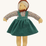 Nanchen Waldorf Doll - Lotte, an organic doll wearing a floral blouse, green cord pinafore dress and a brown bonnet. 