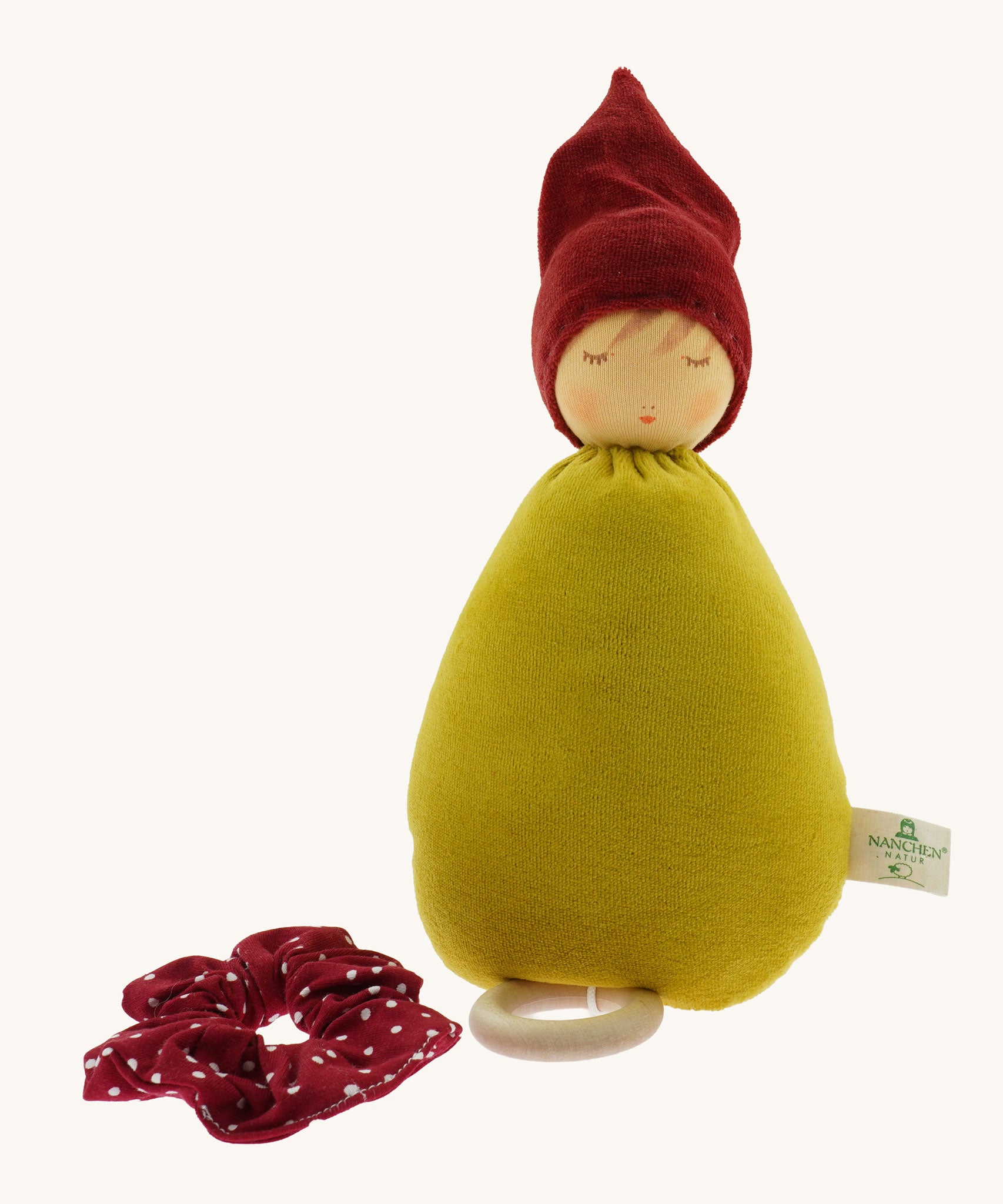 The Nanchen Little Red Riding Hood Lullaby Music Doll shown with it's red collar removed. A musical Waldorf doll, made from organic cotton and sheep's wool. 