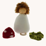 A Nanchen Toadstool Lullaby Music Doll shown with its hat and collar removed. A musical Waldorf doll, made from organic cotton and sheep's wool. 